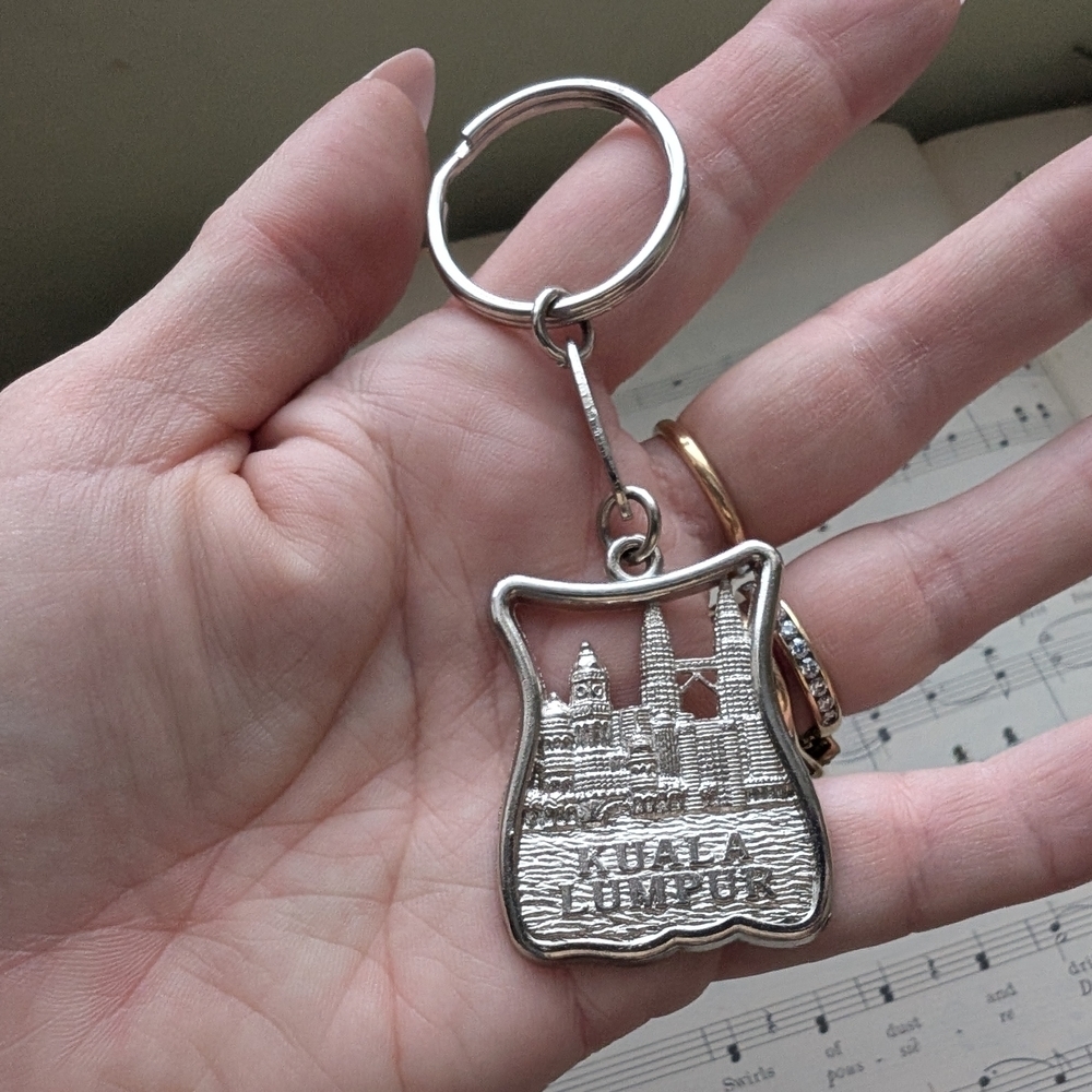 Silver Keychain with Cityscape Design
